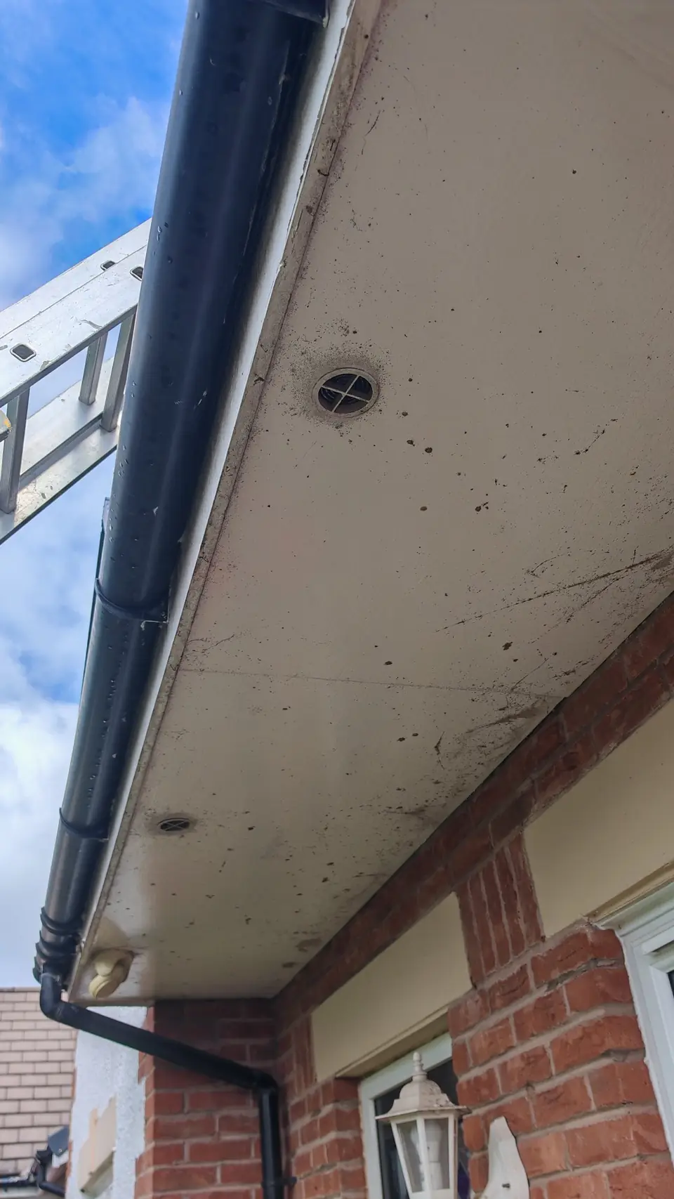 Before: dirty, stained porch soffit ready for preparation