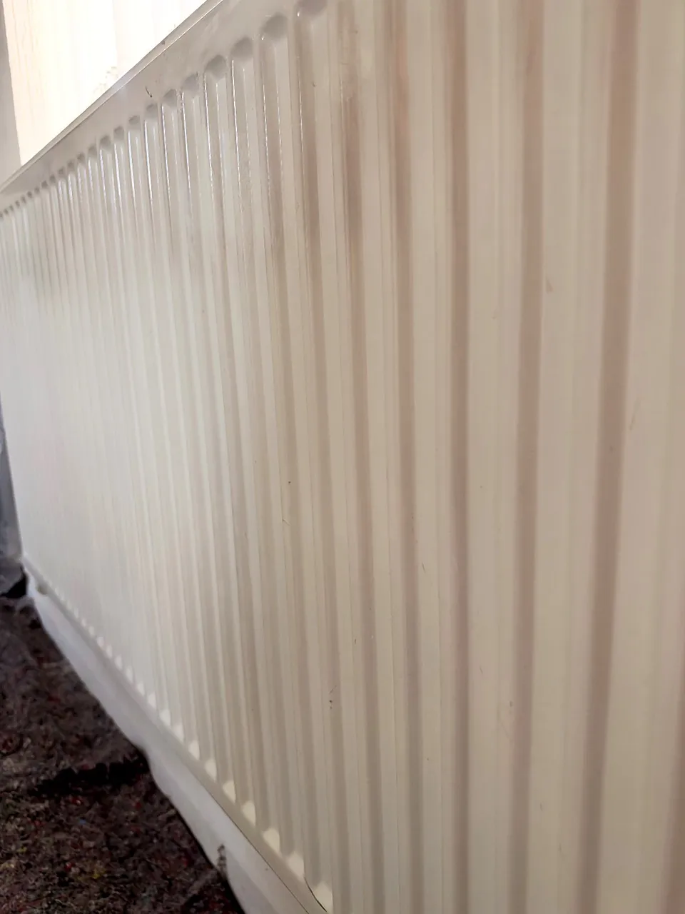 Before: close-up of the worn, yellowed finish