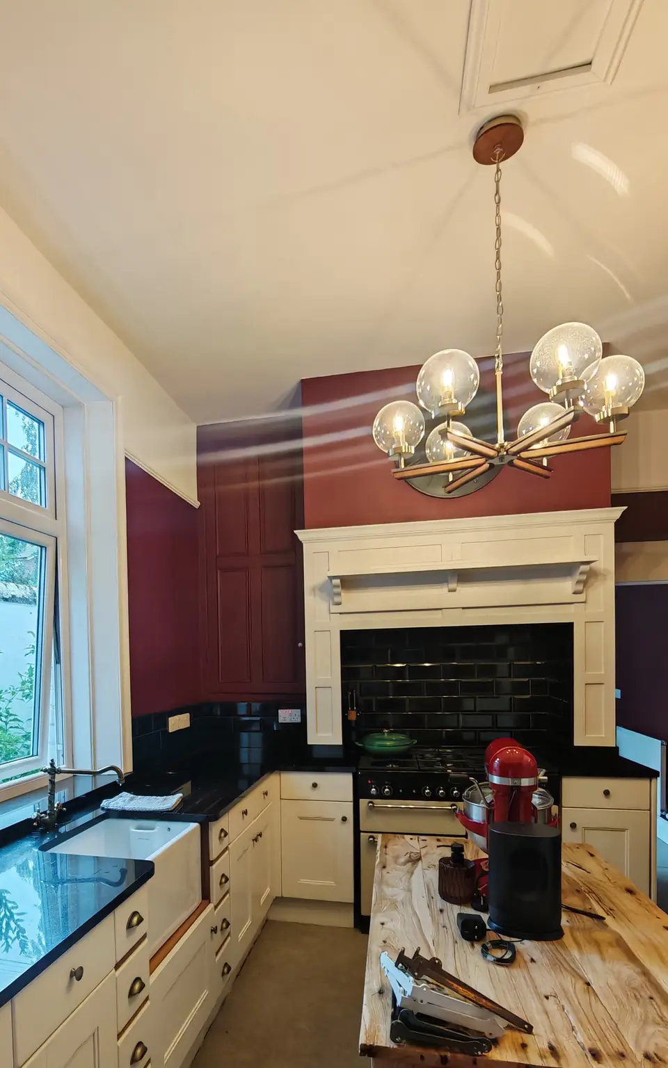 After: burgundy walls and freshly resprayed cream units, same view
