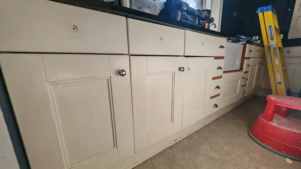 Before: worn cream cabinet doors ready for respraying