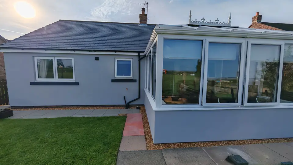 After: rear and conservatory, grey render
