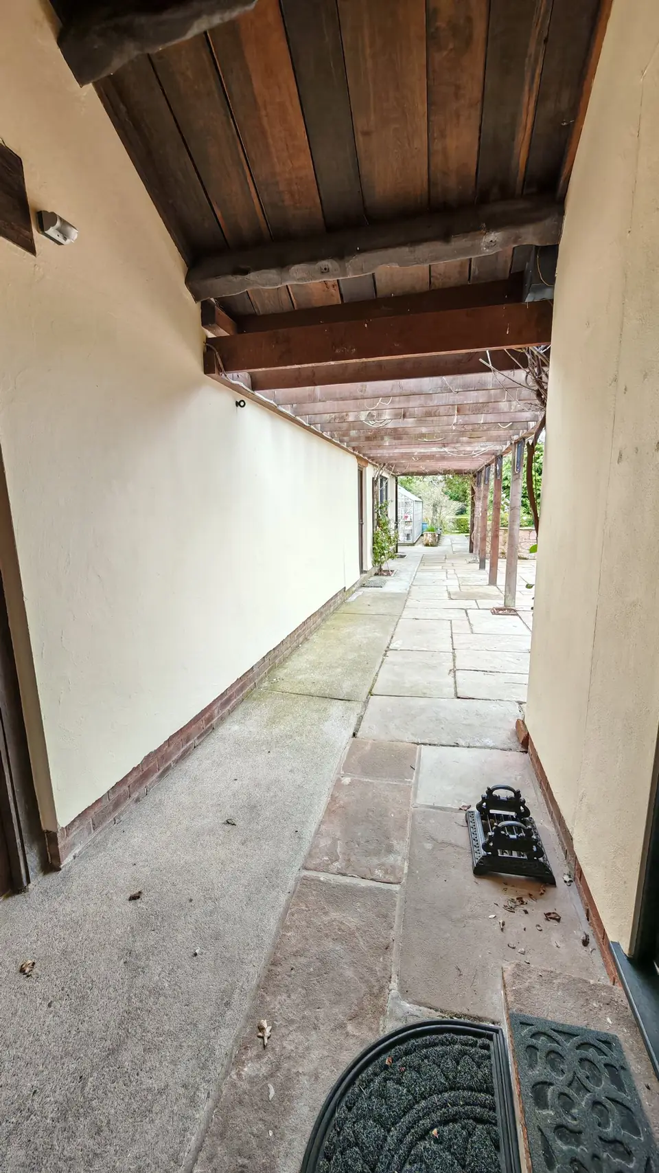 Covered side walkway, walls freshly painted