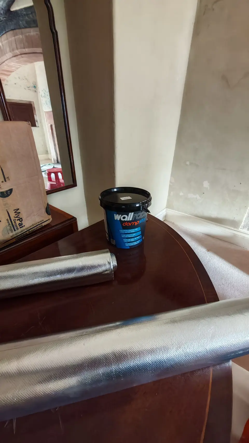 During: Wallrock Damp Stop adhesive and foil ready to go on the damp wall