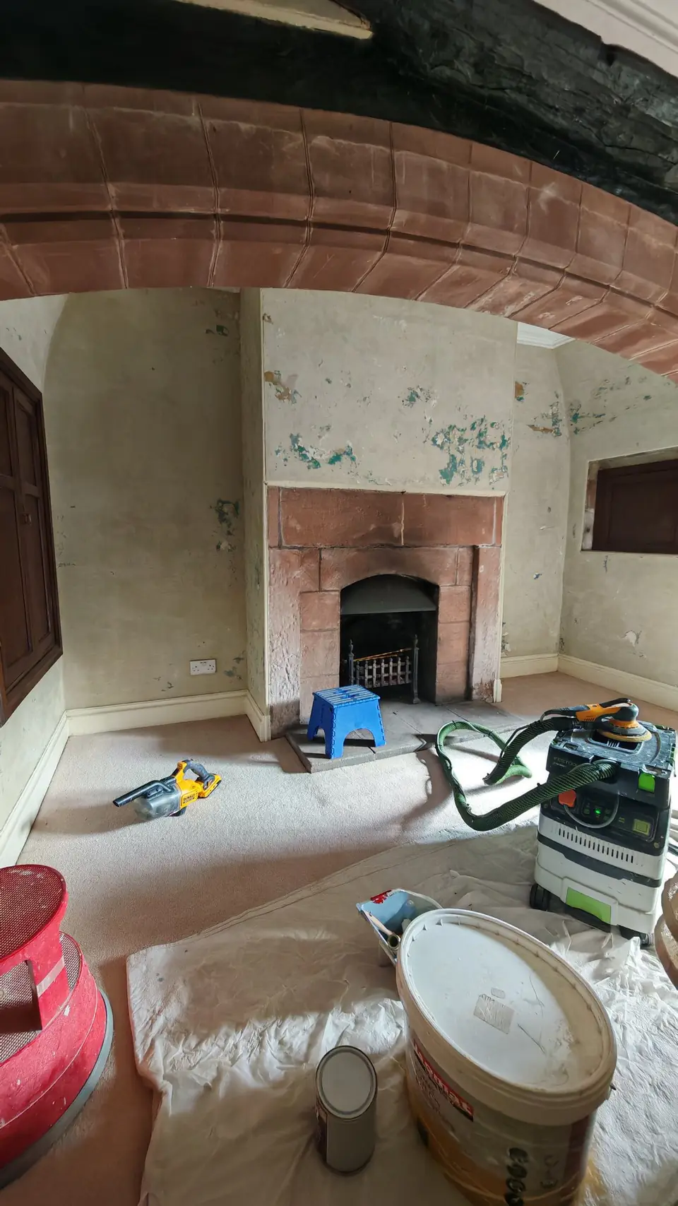 During: the wall sanded back with a Festool sander and dust extractor