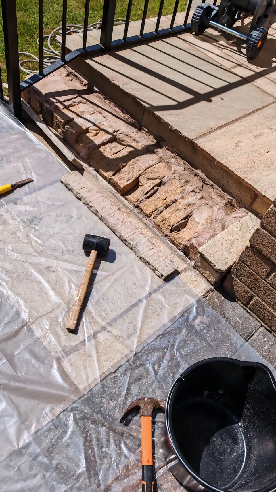 During: sandstone steps being repaired