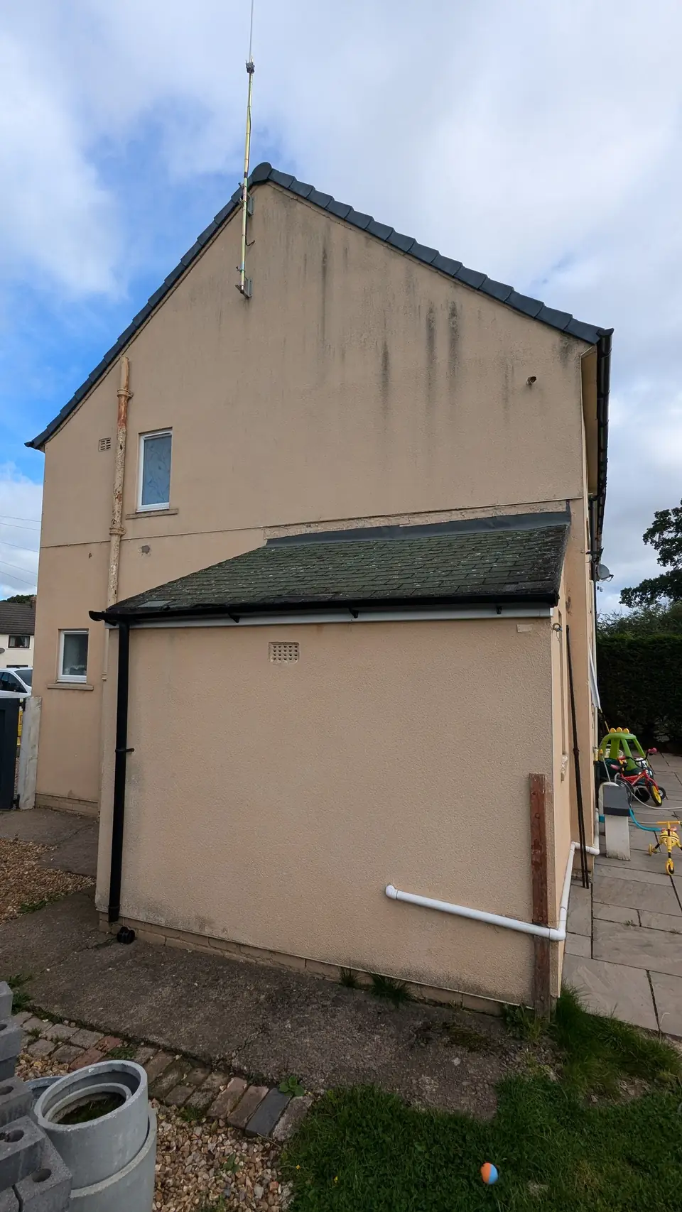 Before: beige rendered gable and rear extension