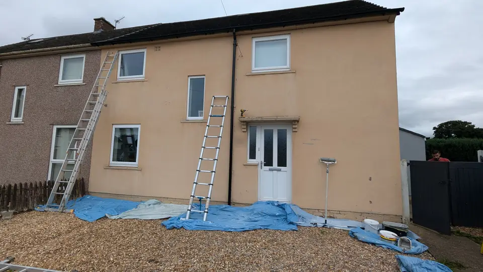 During: ladders up and render being painted