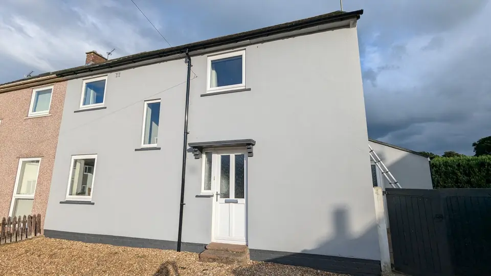 After: semi-detached house painted light grey