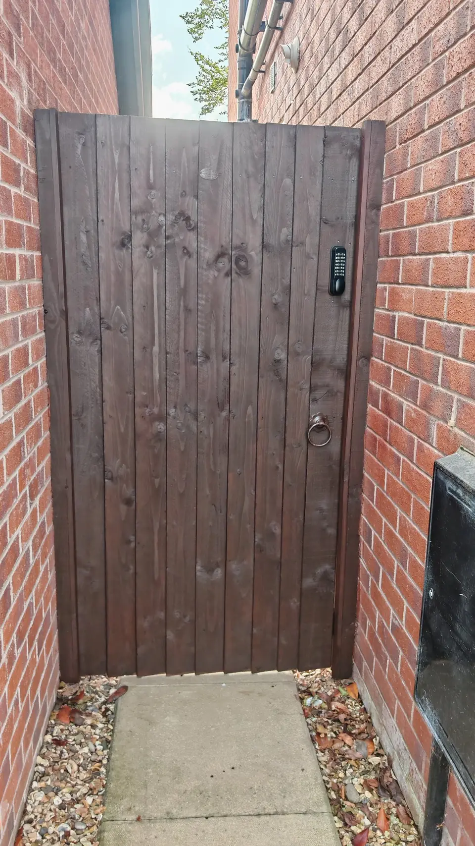 Side gate re-coloured dark brown to match the fence