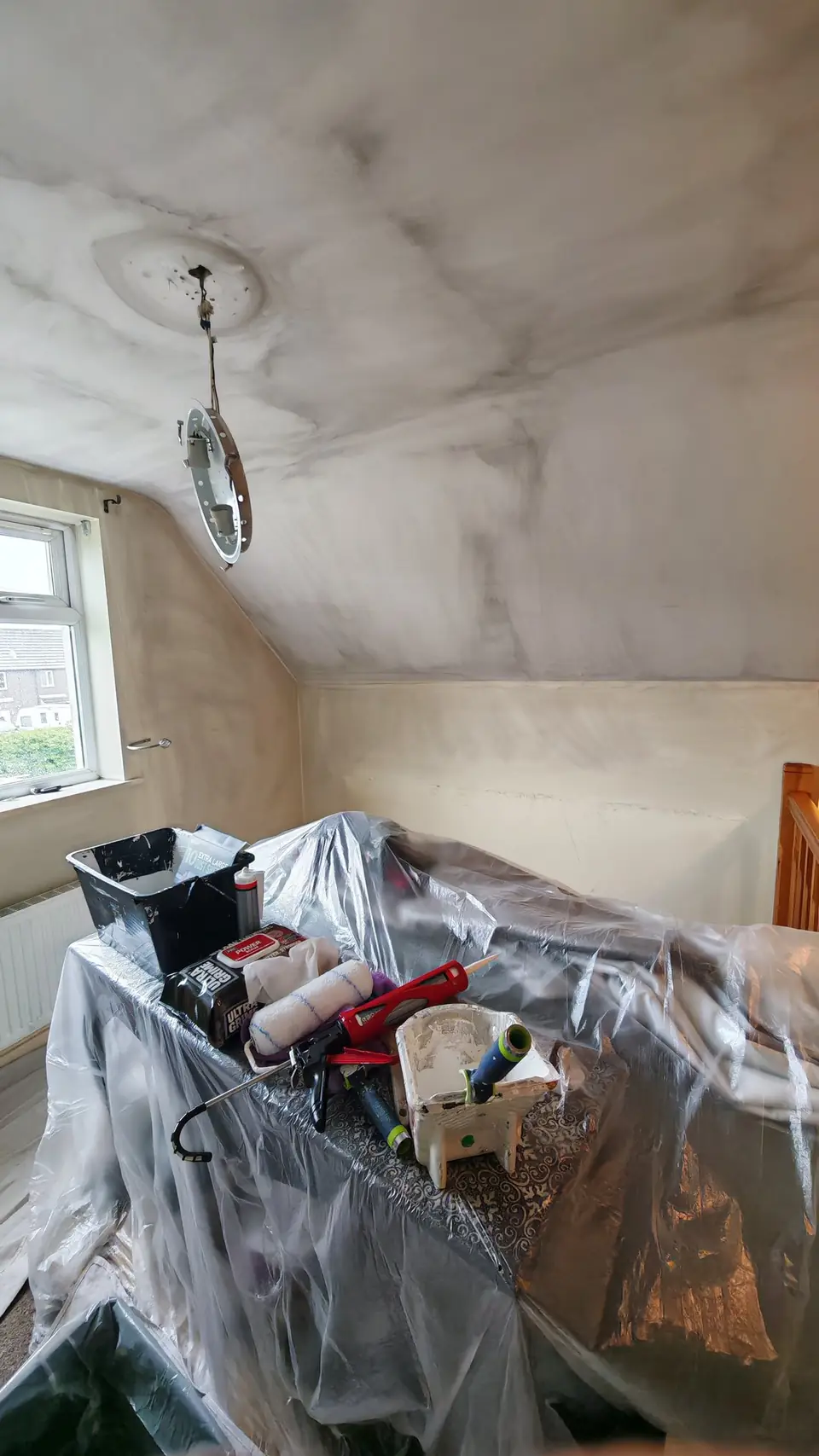 Before: smoke-blackened ceiling in an attic bedroom