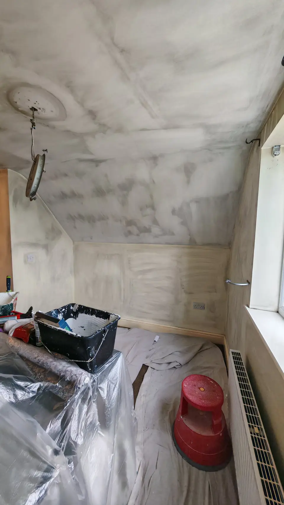 Before: smoke staining across the sloping ceiling and walls