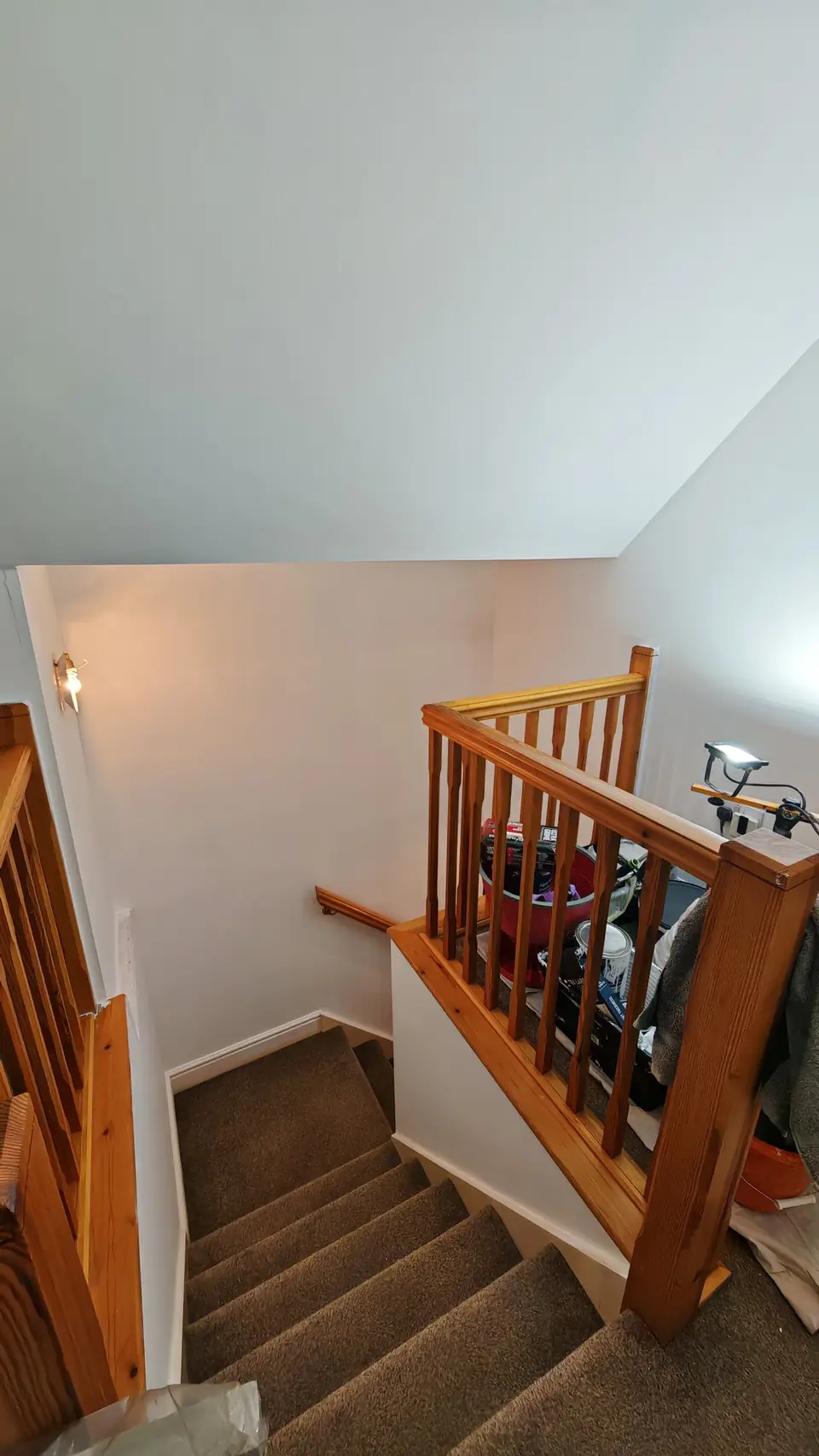 Stairwell walls and ceiling repainted white after smoke damage