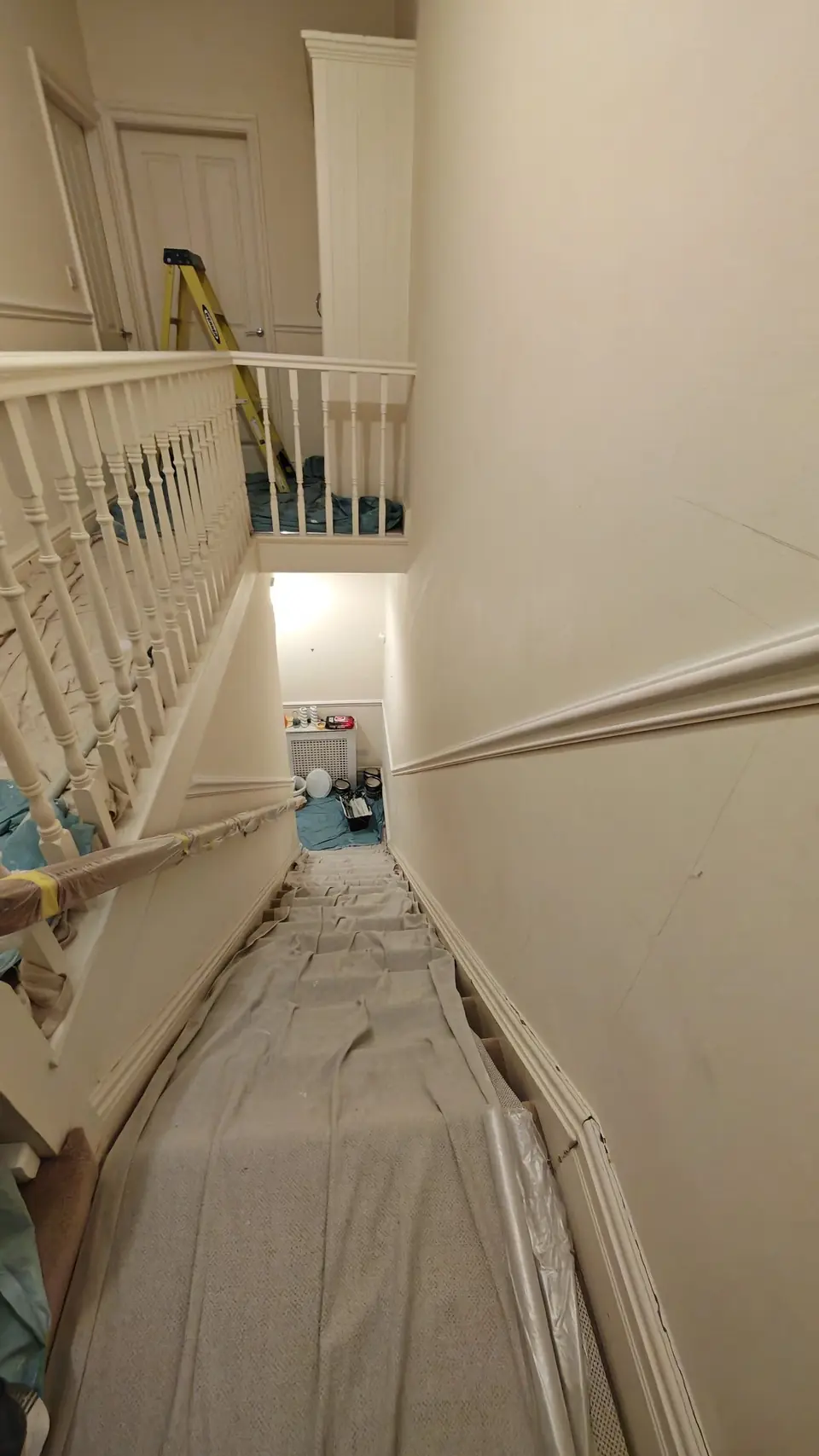 Before: stairs in cream, dust sheets down