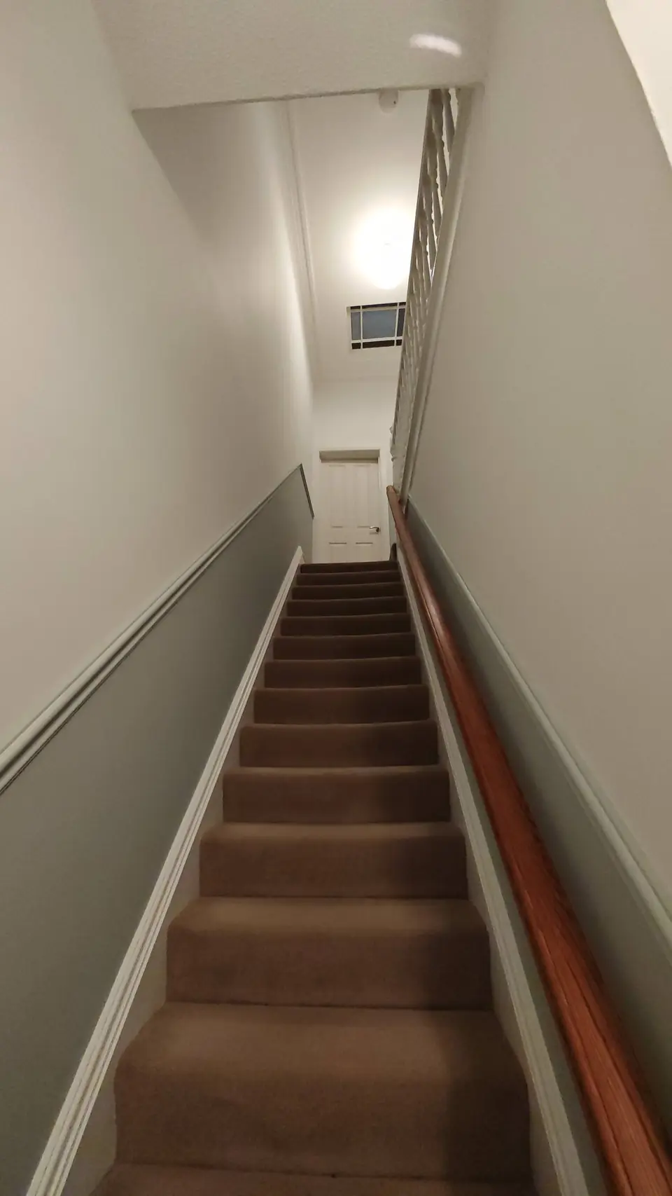 Staircase in grey-green and off-white, white gloss skirting and dado rail