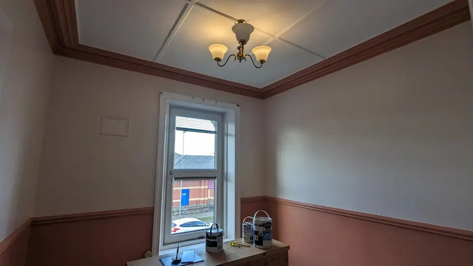 Terracotta dado room towards the window