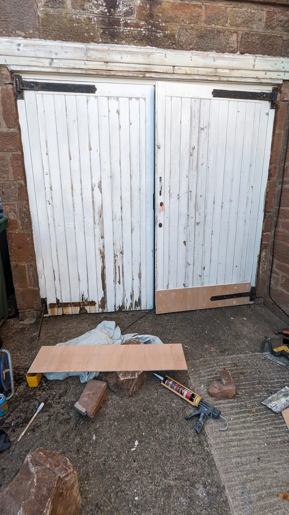 Before: peeling timber garage doors