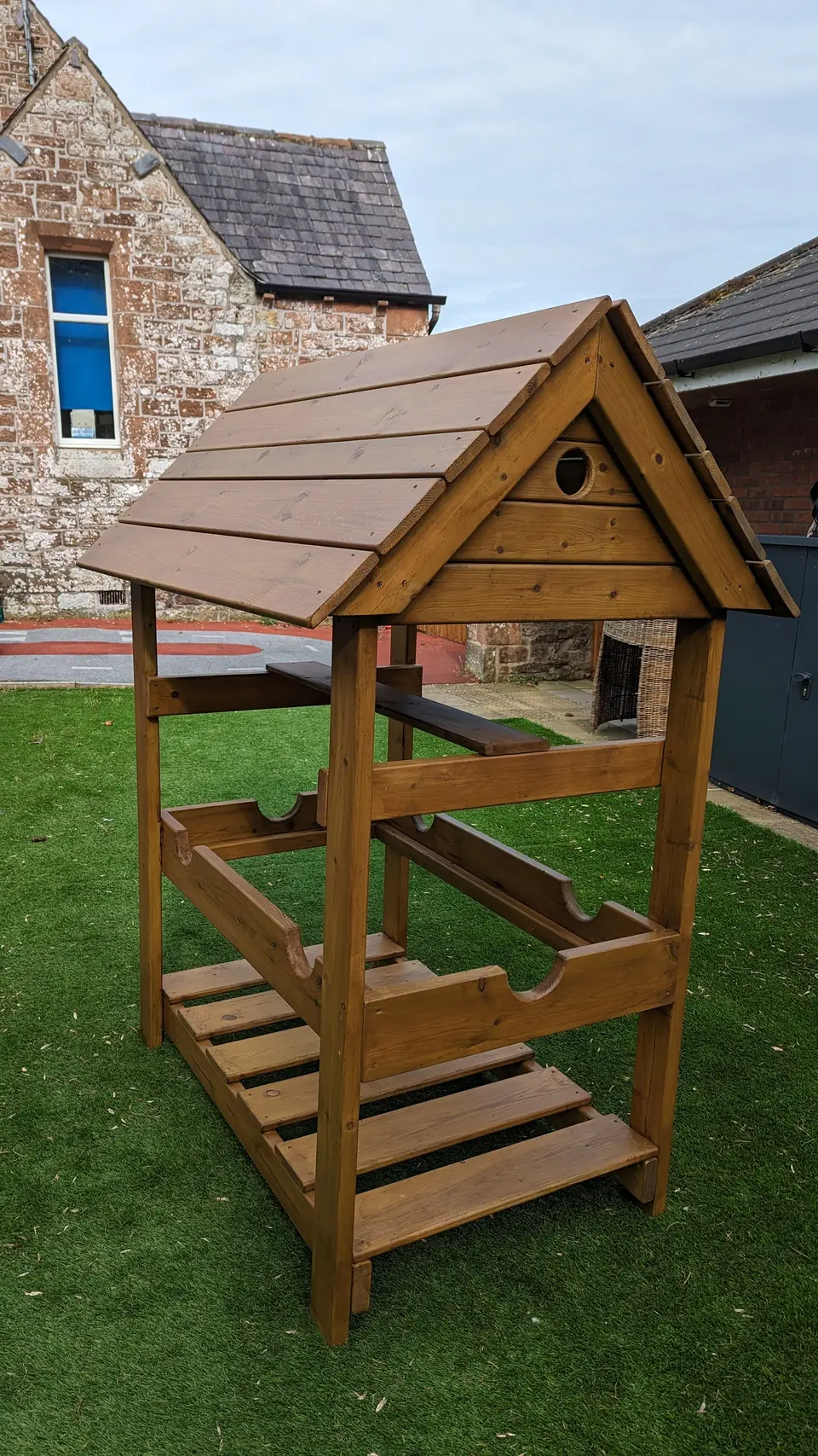 Wooden roofed garden feature built and treated