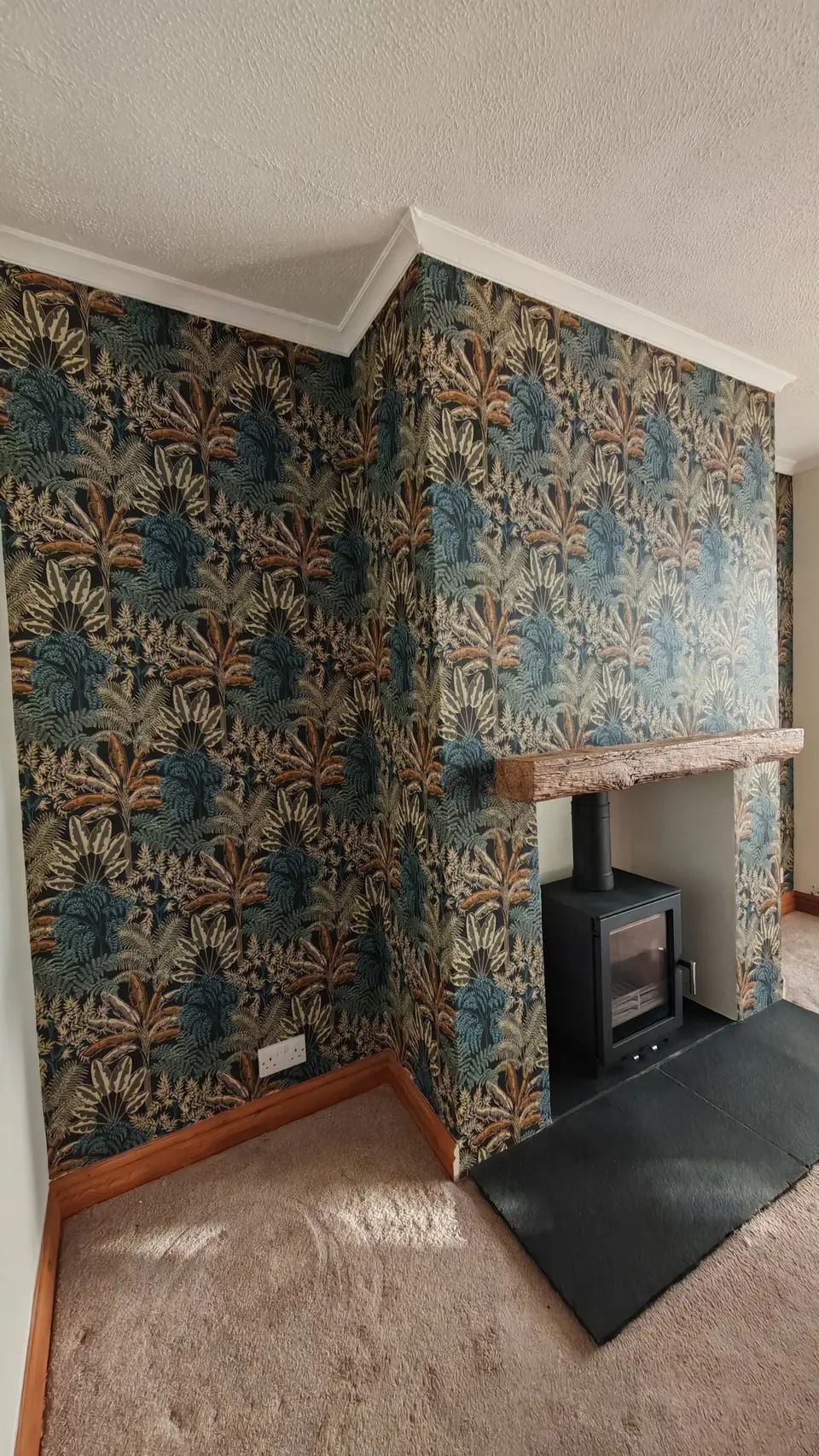 Chimney breast feature wall in bold tropical wallpaper