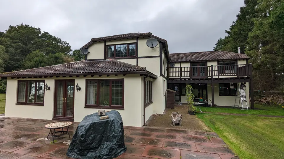 Tudor-style house front with patio