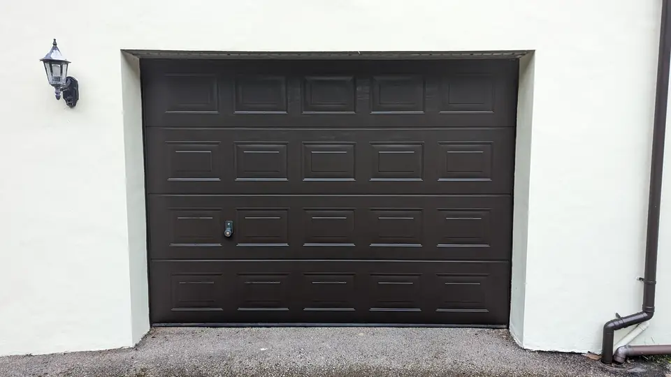 Dark brown garage door with cream walls
