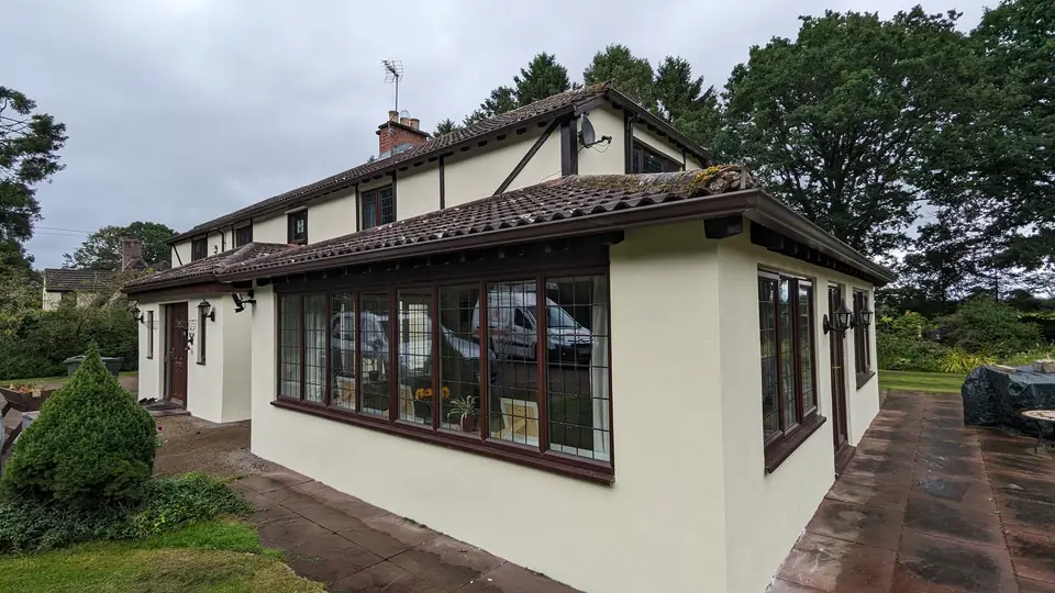 Side of the Tudor-style house in cream