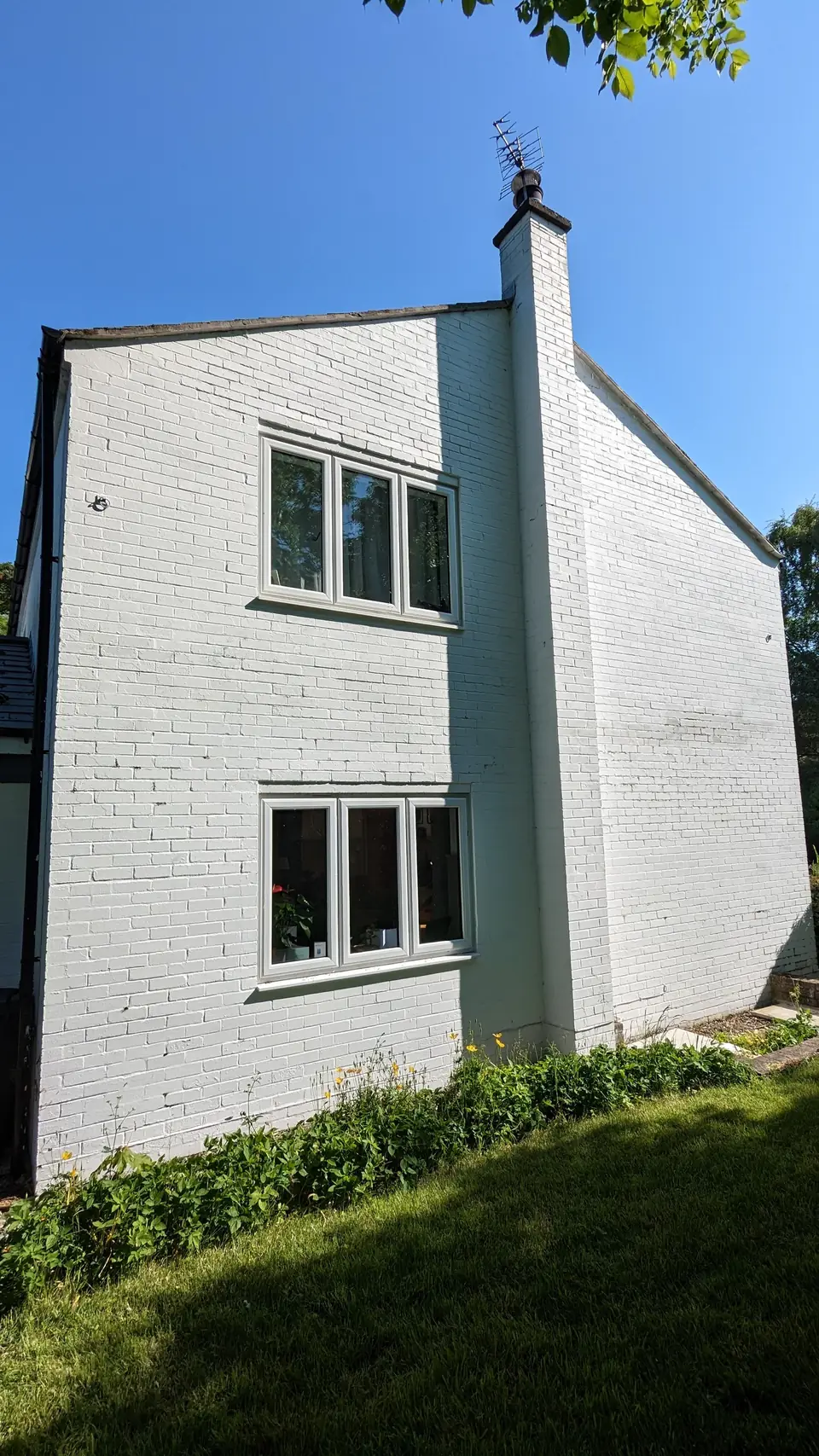 White farmhouse gable and chimney